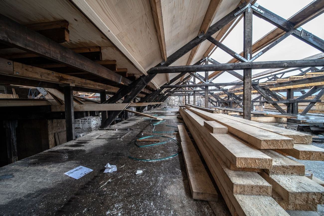 Termite-damaged beams and lumber being replaced